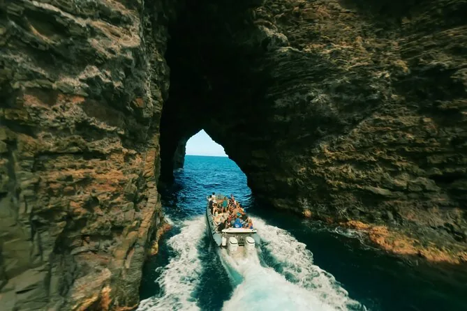 A raft entering a narrow sea arch